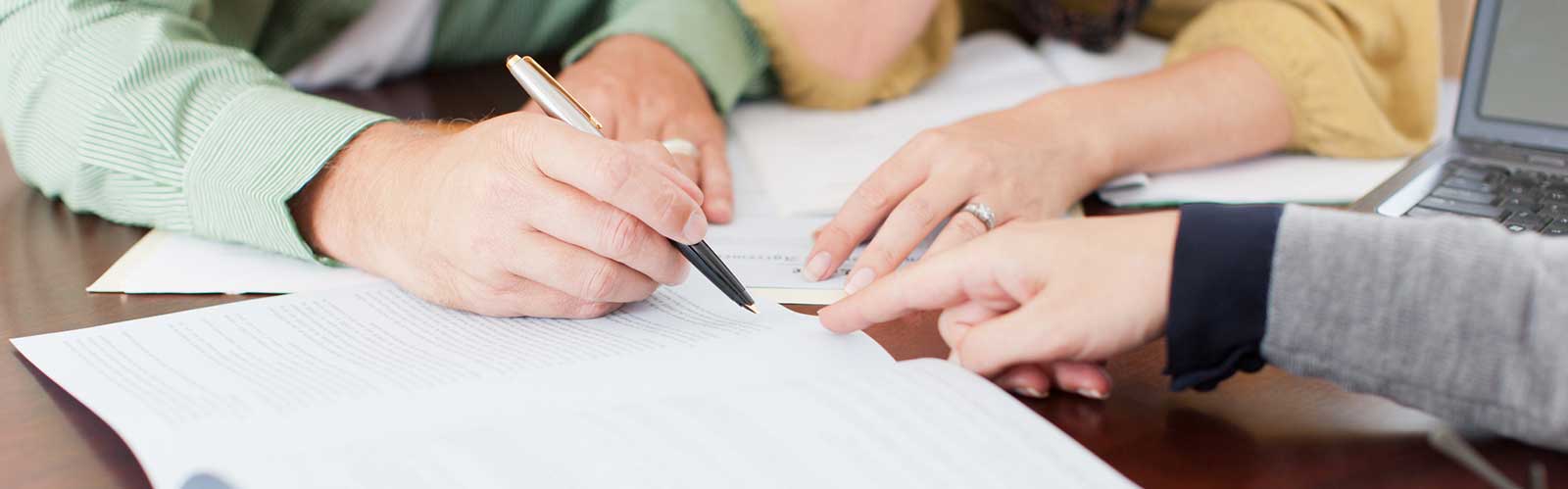 people writing on a ledger header image