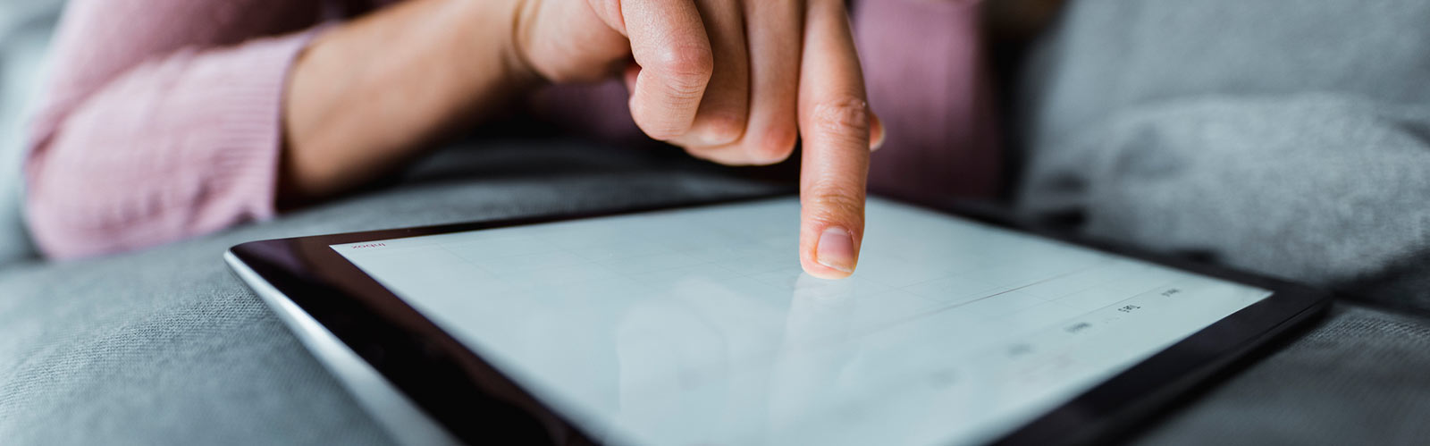 a person working with their tablet device