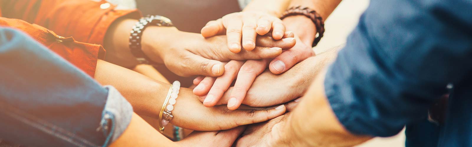 hands piled on top of one another